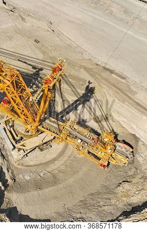 Huge Bucket Wheel Excavator Or Mobile Strip Mining Machine Mining Coal In A Quarry. Heavy Industry C