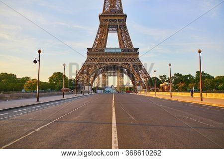 Scenic View Of Eiffel Tower Over Iena Bridge. Empty Streets Of Paris Without Tourists Duing Quaranti