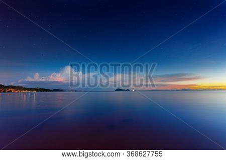 Sunset Time With Lightning And Can See The Stars In The Sky At Wok Tum Beach Phangan Island,thailand