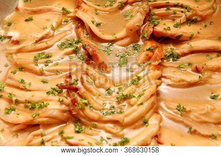 Pork Steak With Brown Sauce And Parsley Leaves