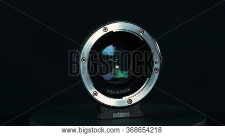 Tomsk, Russia - May 28, 2020: Metabones Speedbooster 0.71 Ultra Standing On A Black Turntable, Micro