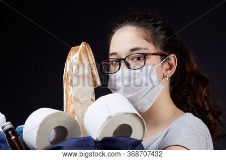 Young Woman In Protective Mask With A Bag Full Of Groceries From The Supermarket
