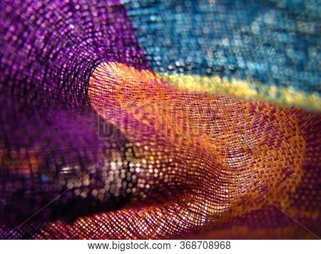 Makro Shot Of Colorful Woven Light Fabric In Soft Light