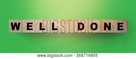 Well Done Written On A Wooden Cubeon Green. Good Job Great Result Business Temawork Business Concept