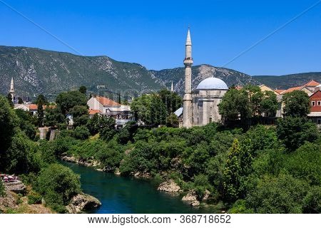 Mostar, Bosnia And Herzegovina - July 11, 2019: Scenic View From Mostar Bridge Of The Neretva River 