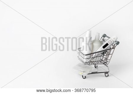 Thermometer, Gel And Spray For Disinfection In A Shopping Cart.