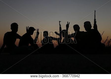 Silhouette Photo Of Fighters In Syria After The Battle With Isis Ended