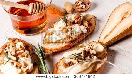 Ngredients For Cooking Bruschetta With Feta Cheese, Cherry Tomatoes And Avocado On A Wooden Table, T