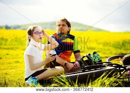 Sport And Quarantine. 9 Years Girl Ciclist With Father Having Rest Breathing Without Masks Admist Th
