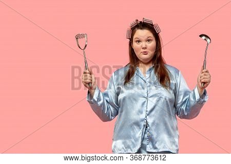 A Plus Size Model Girl With A Surprised Face Looks Into The Camera. On The Gogol Buguri.