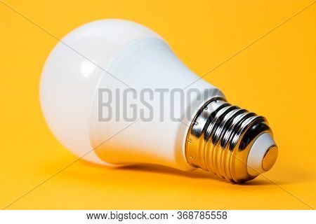 Led, New Technology Light Bulb On Yellow Background, Energy Super Saving Electric Lamp Is Good For E