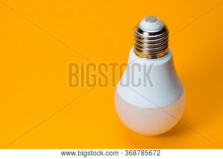 Led, New Technology Light Bulb On Yellow Background, Energy Super Saving Electric Lamp Is Good For E