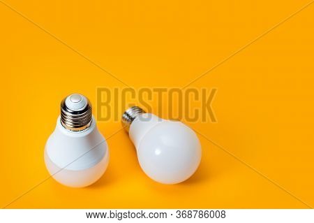 Led, New Technology Light Bulb On Yellow Background, Energy Super Saving Electric Lamp Is Good For E