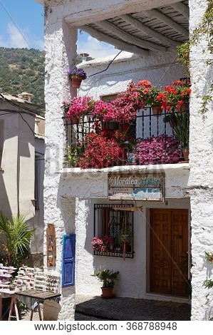 Capileira, Andalucia, Spain - May 29, 2019: Many Flowers In Flower Pots On The Street Of Capileira S
