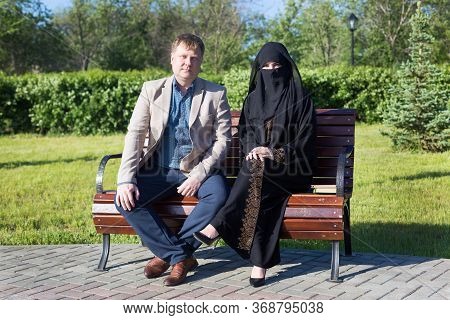 The Friendship Of A European Man And A Muslim Woman. A Date Of An Adult Caucasian Man And Young Isla