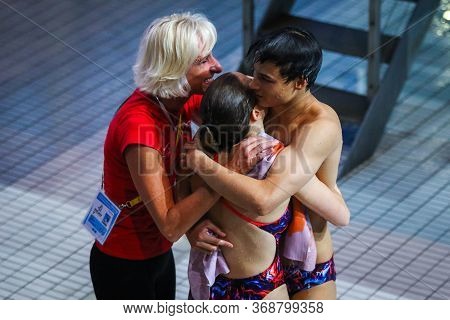 Kyiv, Ukraine - August 6, 2019: Michelle Heimberg And Jonathan Suckow Of Switzerland Hug With Their 