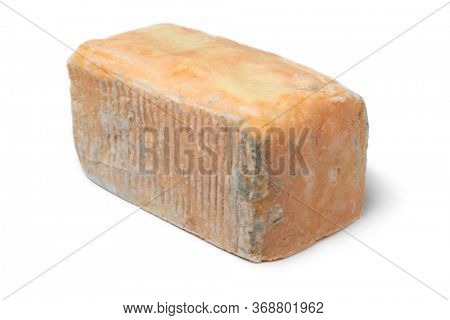 Piece of traditional Taleggio dop close up isolated on white background