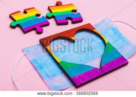 Lgbt Symbol Puzzles And Heart Frame Painted By A Rainbow On A Medical Mask. Coronavirus Quarantine, 