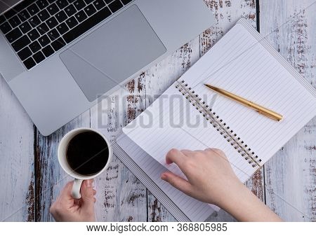 Young Woman Working With A Laptop During Isolation Or Quarantine.