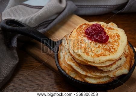 Delicious Sweet American Pancakes With Jam In A Hot Pan On The Table.