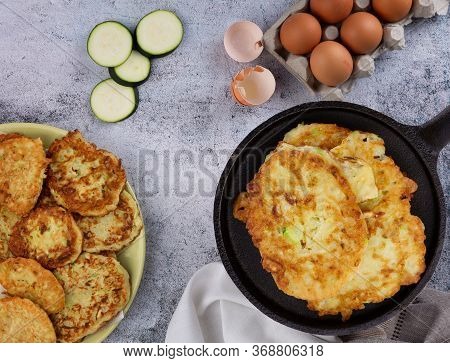 The Process Of Making Pancakes From Zucchini.