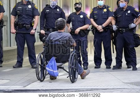 May 29, 2020 - Houston, Texas, USA: Police and spectators collide in downtown Houston, TX as rioters protest the beating and killing of George Floyd by Minneapolis police earlier in the week.