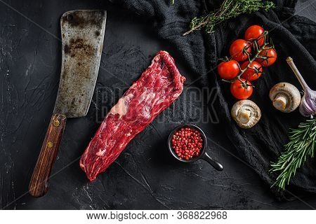 Organic Machete Or Skirt Steak Near Butcher Knife With Pink Pepper And Rosemary. Black Background. T