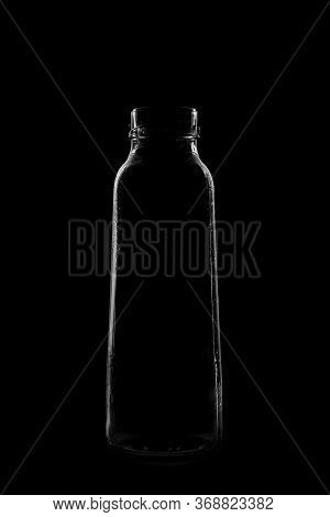 Silhouette Of A Bottle With A Beautiful Shape On A Black Background