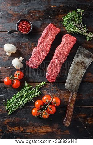 Organic Denver Steak, Raw Meat, Marbled Black Angus Beef Cut On Metal Butcher Cleaver Knife With Ros