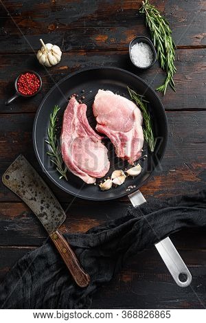Fresh Raw Pork Meat On Frying Grill Pan With Butcher Knife Or Cleaver And Ingedients For Grill Top V