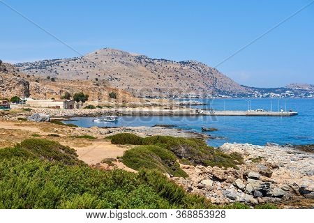 Rocky Coast With Transparent Water Near Glistra And Ladros Beach On The Island Of Rhodes
