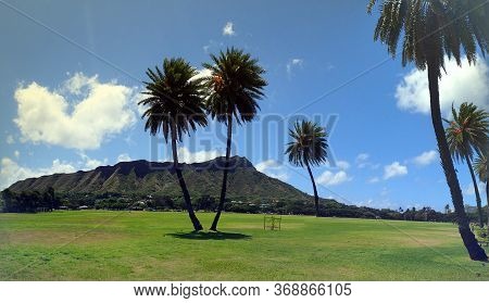 Kapiolani Park With Diamond Head And Clouds In The Distance On Oahu, Hawaii.