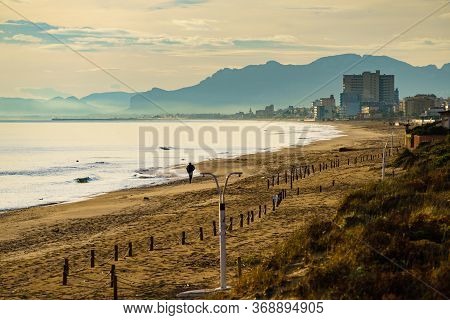 Seascape At Morning, Beach In Gandia. Montgo Mountain Massif Silhouetted On Horizon. Valencia Spain.