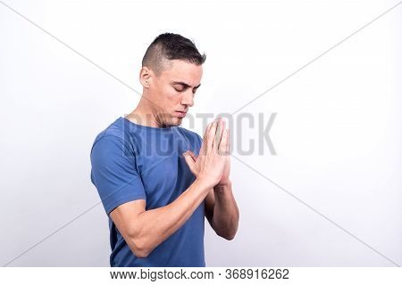 Man Praying. White Back Ground, Medium Shot
