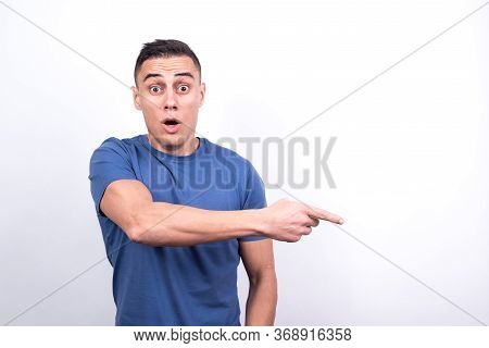 Surprised Man Pointing To Copy Space