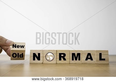 Hand Flipping Wooden Block Cubes For Change Old To New Normal Wording. The World Is Changing To Bala