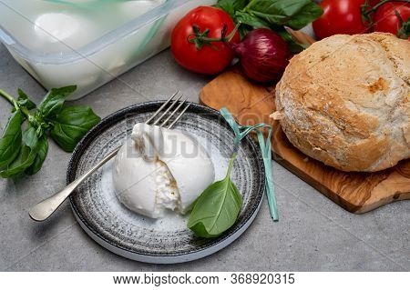 Eating Of Fresh Handmade Soft Italian Cheese From Puglia, White Balls Of Burrata Or Burratina Cheese
