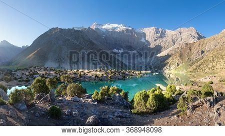 Beautiful Panorama Of Fann Mountains. Alaudin Lake In Fann Mountains, Tajikistan. Summer Day For Hik
