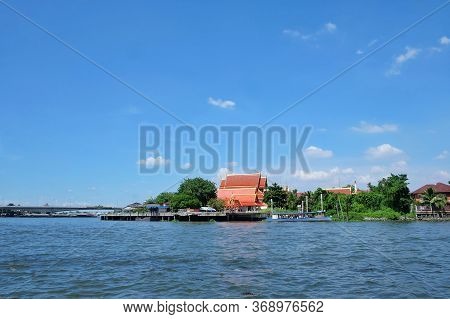 River Waves Against Blue Sky White Fluffy Clouds In Evening And Pharam-4 Bridge View,koh-kret,nontha