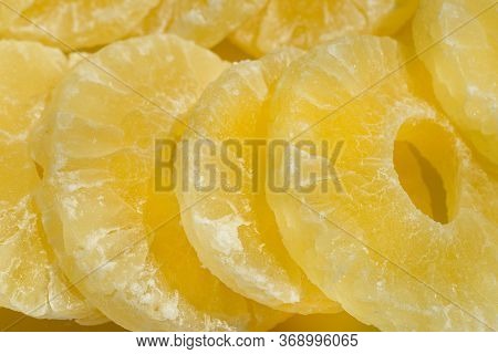 Dried Pineapple Candy Rings, In Powdered Sugar, Close-up In Sunlight.