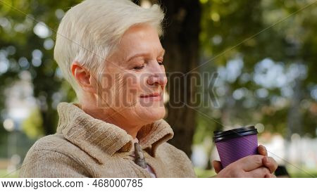 Wrinkled Face Of 60s Happy Elderly Woman Outdoors In Park Looking Aside Having Wide Smile, Dental Im