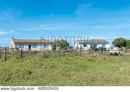 Struisbaai, South Africa - Sep 22, 2022: Farm Worker Houses At Prinskraal Next To The Road Between A