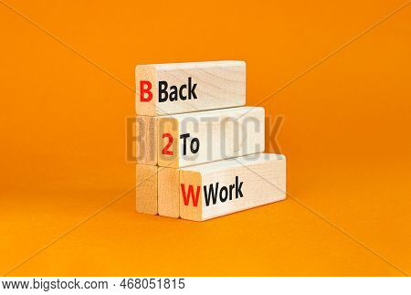B2w Back To Work Symbol. Concept Words B2w Back To Work On Wooden Blocks On A Beautiful Orange Table