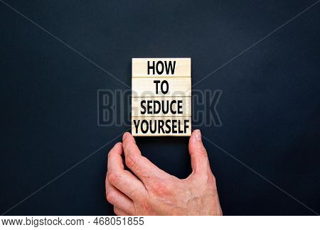 How To Seduce Yourself Symbol. Concept Word How To Seduce Yourself On Wooden Blocks. Businessman Han