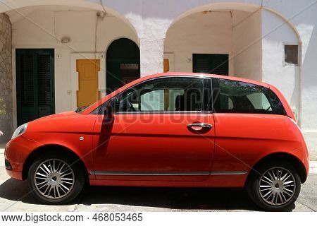 Salento, Italy - June 2, 2017:  Lancia Ypsilon Small Red Hatchback Car Parked In Italy. There Are 41