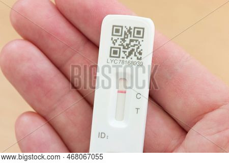 United Kingdom - March 26, 2022. Man Holding An Lft Test Strip With Negative Result In Hand, Covid (