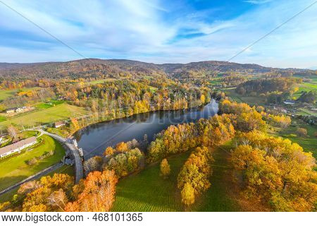 Fojtka Water Reservoir Surrounded By Vibrant Colored Forest At Autumn Time. Aerial View From Drone.