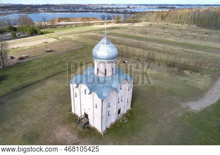 Medieval Church Of The Transfiguration On Nereditsa (1198) In Rural Spring Landscape (aerial View). 