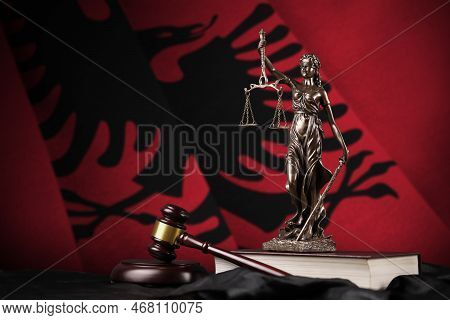 Albania Flag With Statue Of Lady Justice, Constitution And Judge Hammer On Black Drapery. Concept Of