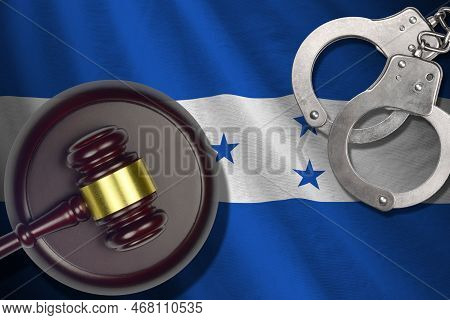 Honduras Flag With Judge Mallet And Handcuffs In Dark Room. Concept Of Criminal And Punishment, Back